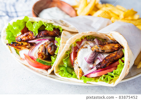 Chicken gyros with vegetables Chicken gyros with vegetables 83875452