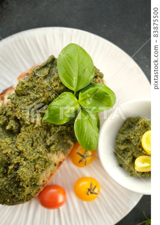 Ciabatta with tomato, mozzarella and rocket salad with pesto sauce. 83875500