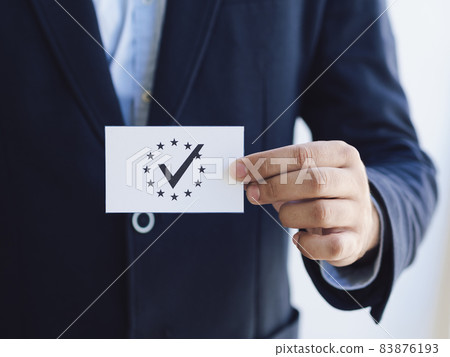 front view man holding ballot. High quality beautiful photo concept 83876193