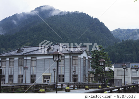Kunigami Hachiman Old Government Building Memorial Hall and Mountains after the early morning rain in September 83876538