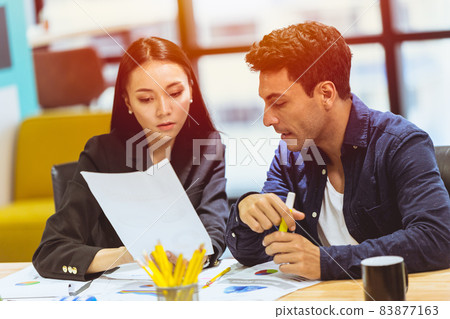 Smart business Asian women office worker staff working in office with male teamwork mix race. 83877163