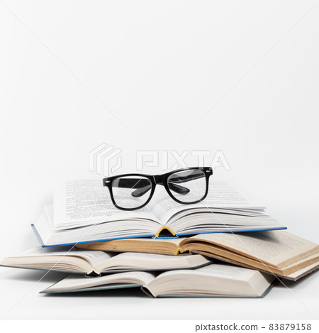 front view open books with glasses. High quality beautiful photo concept 83879158