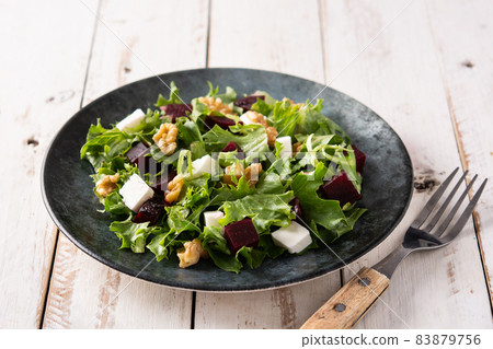 Beetroot salad with feta cheese,lettuce and walnuts 83879756