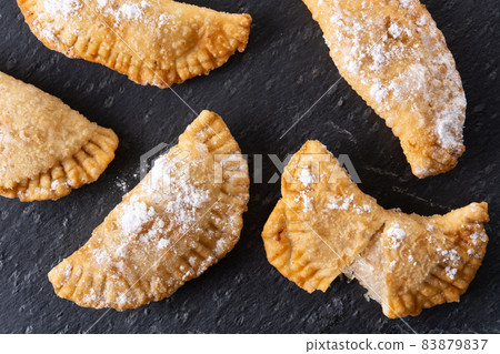 Spanish sweet stuffed pastry filled with angel hair 83879837
