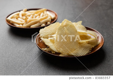 French fries snack, Potato chips and a glass of cola. Food and drink concept. French fries snack, Potato chips and a glass of cola. Food and drink concept. 83883357