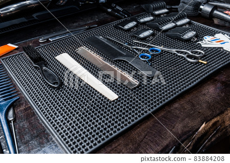 Professional tools and equipment for haircuts and hairstyles in a hairdresser or barbershop Professional tools and equipment for haircuts and hairstyles in a hairdresser or barbershop 83884208