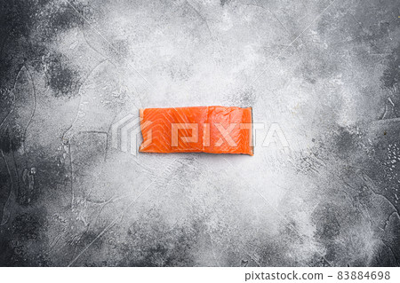 Salmon. Fresh raw salmon fish fillet, on gray stone table background, top view flat lay, with copy space for text 83884698