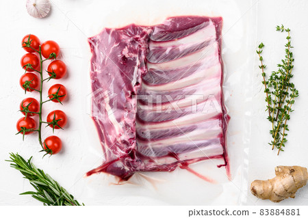 Lamb meat rib rack, on white stone table background, top view flat lay 83884881