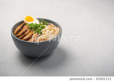 Ramen is asian noodles in a bowl with meat and vegetables or seafood, copy space Ramen is asian noodles in a bowl with meat and vegetables or seafood, copy space 83885133