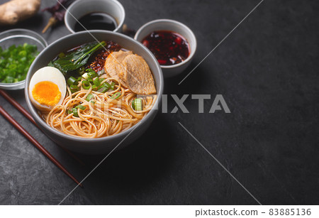 Ramen is japanese noodles in a bowl with meat and vegetables or seafood Ramen is japanese noodles in a bowl with meat and vegetables or seafood 83885136