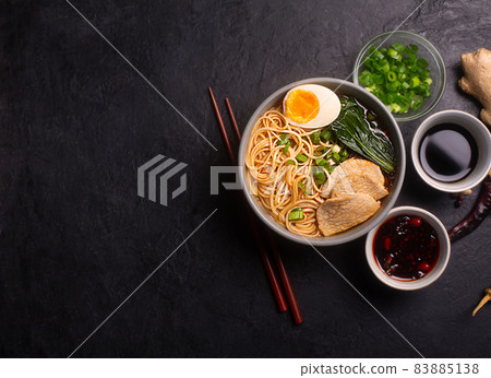 Ramen is asian noodles in a bowl with meat and vegetables or seafood with copy space 83885138