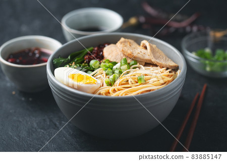 Ramen is asian noodles in a bowl with meat and vegetables or seafood Ramen is asian noodles in a bowl with meat and vegetables or seafood 83885147