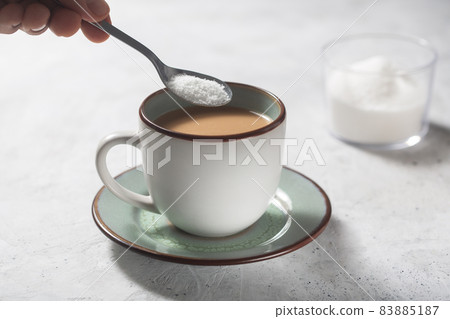 Man making coffee with milk and sweetener Man making coffee with milk and sweetener 83885187