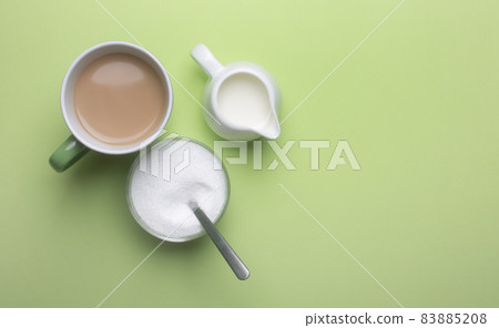 Coffee with milk and sweetener in a bowl 83885208
