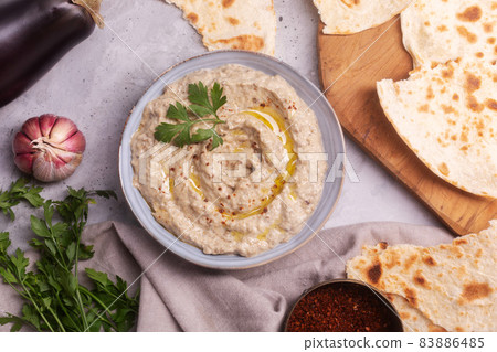Baba ganoush baked eggplant with sesame paste with ingredients close-up top view 83886485