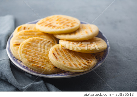Traditional Venezuelan food arepa made from cornmeal Traditional Venezuelan food arepa made from cornmeal 83886518