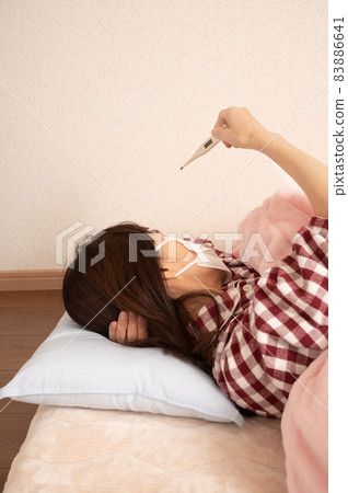 Middle woman sleeping with fever Middle woman sleeping with fever 83886641