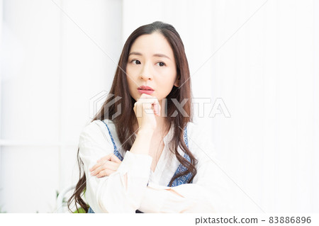 Housewife spending time in the living room with worries 83886896