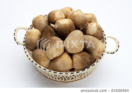 Straw mushroom in basket on white background. Straw mushroom in basket on white background. 83886984