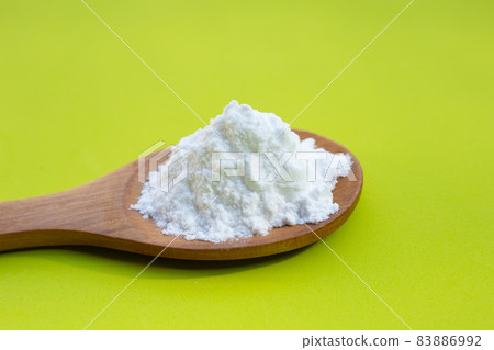 Baking soda on green background. Baking soda on green background. 83886992