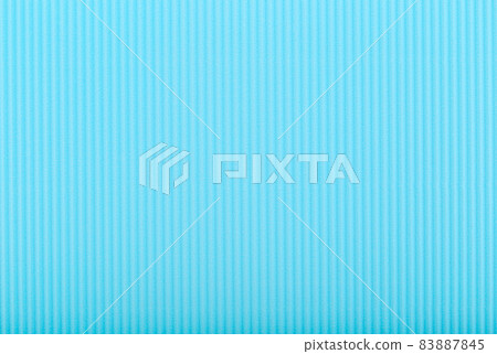 Abstract blue background with small vertical lines. Corrugated paper close up. Textured background with copy space Abstract blue background with small vertical lines. Corrugated paper close up. Textured background with copy space 83887845
