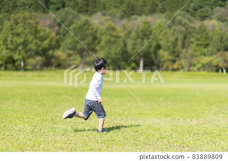 A 4-year-old boy running around in nature A 4-year-old boy running around in nature 83889809