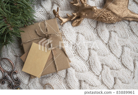 new year gift mockup. Craft gift box in hands. 83889961
