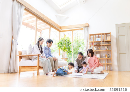 Three-generation family relaxing in the living room Three-generation family relaxing in the living room 83891216