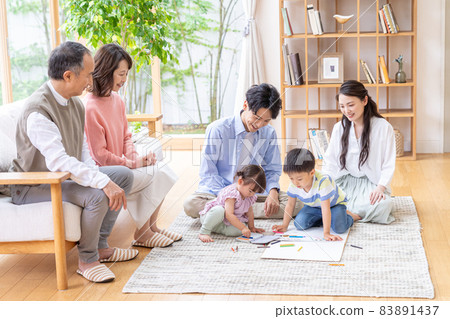 Three-generation family relaxing in the living room Three-generation family relaxing in the living room 83891437