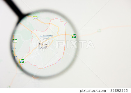 Al Kharj city visualization illustrative concept on display screen through magnifying glass 83892335