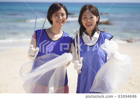 woman picking up trash woman picking up trash 83894696