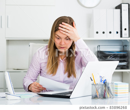 Woman having problem in office Woman having problem in office 83896268