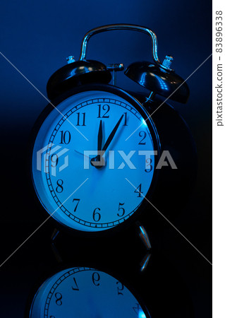Alarm clock close up on black background 83896338