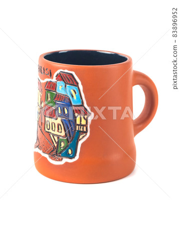 Georgian clay pottery with traditional ornaments on it. White background 83896952