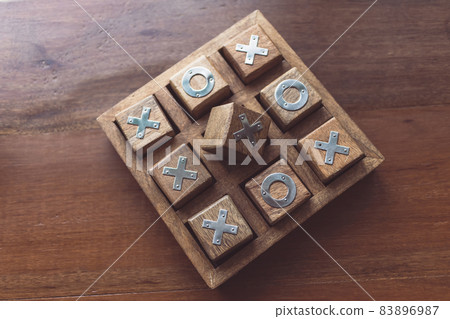 Vintage Tic Tac Toe wooden board game on wooden top table 83896987