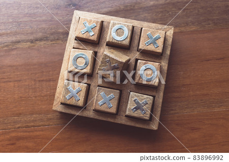 Vintage Tic Tac Toe wooden board game on wooden top table Vintage Tic Tac Toe wooden board game on wooden top table 83896992
