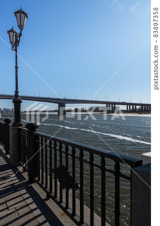 Embankment of Don River and Voroshilovsky bridge in Rostov-on-Don, Russia Embankment of Don River and Voroshilovsky bridge in Rostov-on-Don, Russia 83897358