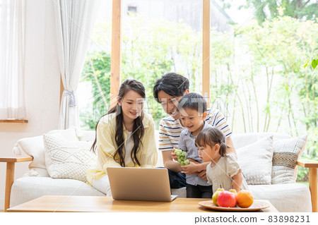 A family relaxing in the living room A family relaxing in the living room 83898231