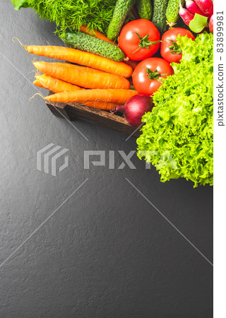 Overhead shot of different vegetables on wooden table 83899981