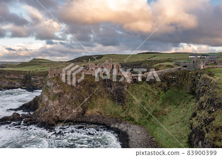 Dramatic sky above Dunluce Castle, County Antrim, Northern Ireland. 83900399