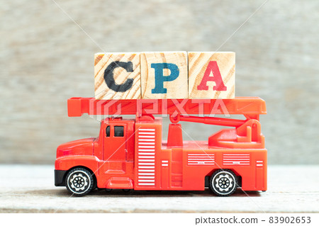 Fire ladder truck hold letter block in word CPA (Abbreviation of Cost per click or Certified public accountant) on wood background Fire ladder truck hold letter block in word CPA (Abbreviation of Cost per click or Certified public accountant) on wood background 83902653