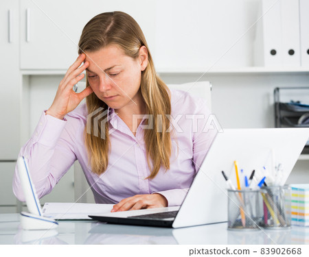 Woman having problem in office Woman having problem in office 83902668