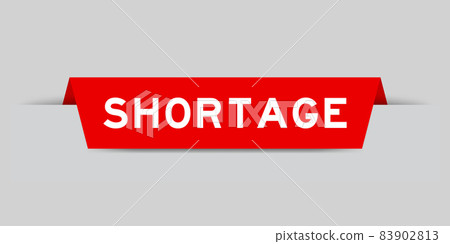 Red color inserted label with word shortage on gray background 83902813