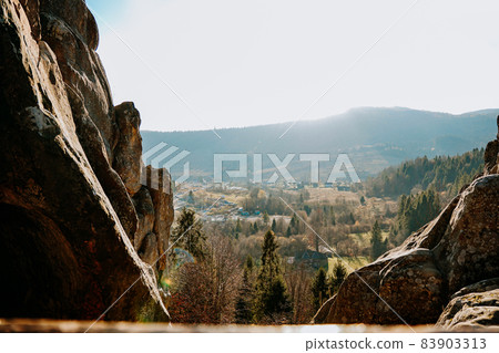 Breathtaking view from Tustan fortress to sunny valley in Carpathian Mountains Breathtaking view from Tustan fortress to sunny valley in Carpathian Mountains 83903313