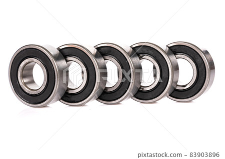 a row of high tech bearings on a white background a row of high tech bearings on a white background 83903896