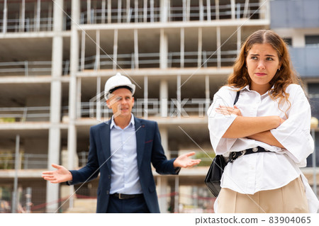 Dissapointed woman in construction site 83904065