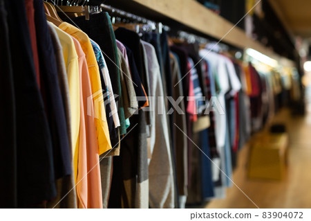 Assortment of summer clothing in modern store Assortment of summer clothing in modern store 83904072