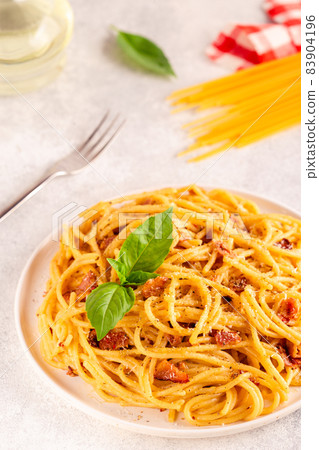 Homemade pasta with pancetta, egg, hard parmesan cheese and cream sauce Homemade pasta with pancetta, egg, hard parmesan cheese and cream sauce 83904196