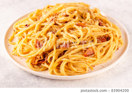 Homemade pasta with pancetta, egg, hard parmesan cheese and cream sauce Homemade pasta with pancetta, egg, hard parmesan cheese and cream sauce 83904200