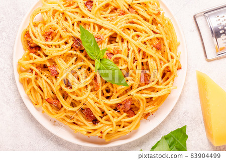 Homemade pasta with pancetta, egg, hard parmesan cheese and cream sauce Homemade pasta with pancetta, egg, hard parmesan cheese and cream sauce 83904499